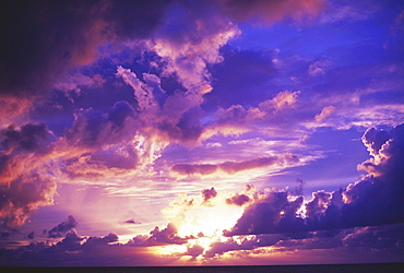 Hawaii, Oahu, North Shore, dramatic sunset over the ocean, purple, pink and blue.