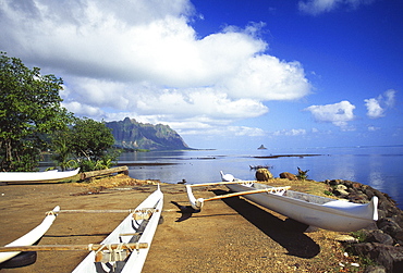 Hawaii, Oahu, Waiahole, outrigger canoes on beach, turquoise water