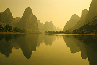 China, Guilin, Piled Silk Mountains, Li River with reflections in water A72H