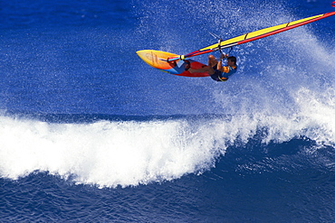 Hawaii, Pete Cabrina jumps wave, windsurfing contest