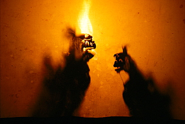 Indonesia, Bali, Wayan Kulit shadow puppets, orange fire 