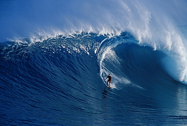 Hawaii, Maui, Buzzy Kerbox surf curling wave at Jaws aka Peahi, curling wave