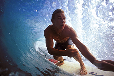 Hawaii, Oahu, North Shore, Pipeline, Pancho Sullivan surfs pipeline, in the tube, arms front