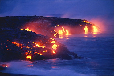 Hawaii, Big Island, Hawaii Volcanoes National Park, lava flow action into ocean twilight A27D