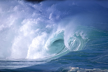 Hawaii, Side distant view of dramatic big waves curling and crashing, whitewash 