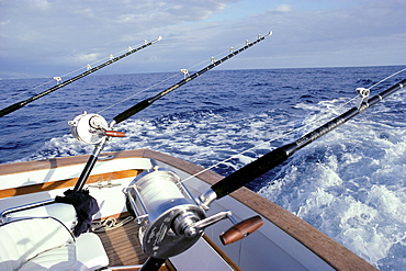 Hawaii, Close-up of fishing rods and reels on a boat deep sea fishing 