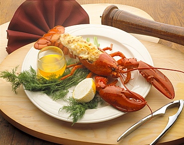 Lobster Thermador, lemon and butter, garnish on plate, wooden platter C1179