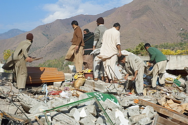 Men Digging For Corpses In The Ruins Of The Bazaar Destroyed By The 8 October 2005 Earthquake, Chinari, Azad Kashmir, Pakistan