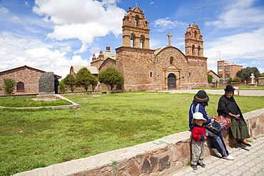 Aymara People Sitting On The Plaza In Front Of The 16Th Century Church, Laja, La Paz Department, Bolivia