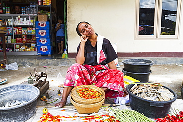 Woman selling hot peppers at the weekly market, Semparu, Lombok, West Nusa Tenggara, Indonesia