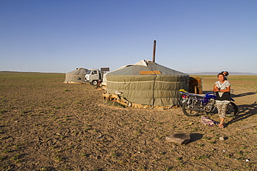 Woman by a Mongolian ger (yurt),Gobi Gurvansaikhan National Park, Ã–mnÃ¶govi Province, Mongolia