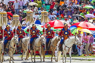 Honour guard in gala uniform riding on horseback carrying the Yesun Hult Tsagaan Tug (The Nine White Banners) at the opening ceremony of the 2014 Naadam Mongolian National Festival celebration in the National Sports Stadium, Ulaanbaatar (Ulan Bator), Mongolia