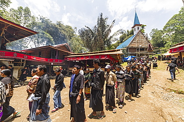 People in a formal funeral procession called Maâ€™passa Tedong at a rante, the ceremonial site for a Torajan funeral, in Sereale, Toraja Land, South Sulawesi, Indonesia