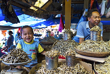 Father and son selling dried fish at the Bolu market, Makassar (Ujung Pandang), South Sulawesi, Indonesia