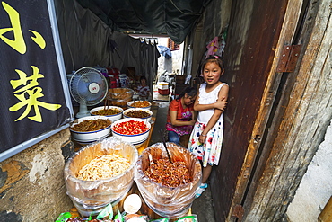 Chinese girl in a food shop, Hongcun, Anhui, China