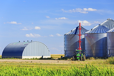 Grain silos and auger, Alberta, Canada