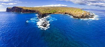 Cliffs along the coastline of the island of Lanai with bright blue ocean water, Lanai, Hawaii, United States of America