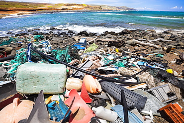 Much of the North side of the island of Molokai is inaccessible. when trade winds blow onshore regularly bringing with them piles of plastic that has been floating around the Pacific Ocean for years and years, Molokai, Hawaii, United States of America