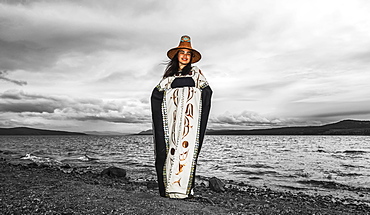 Tlingit first nation woman in traditional wardrobe on the shores of Teslin Lake, Teslin, Yukon, Canada