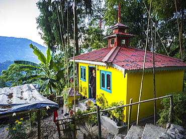 A bright yellow building on the Glenburn Tea Estate, Singringtam, West Bengal, India