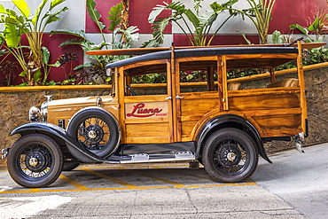 This 1930 Ford Model A Woody classic car is on display at the Luana Hotel, Waikiki, Honolulu, Oahu, Hawaii, United States of America