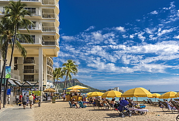 East end of Fort DeRussy boardwalk and beach umbrellas on Waikiki Beach with Diamond Head in the background, Waikiki, Honolulu, Oahu, Hawaii, United States of America