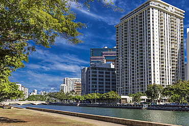 View North across Ala Wai Canal from Ala Wai Promenade towards Kalakaua Avenue bridge, Waikiki, Honolulu, Oahu, Hawaii, United States of America