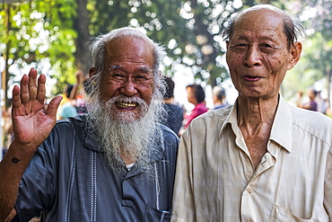 Pose of senior men smiling and waving for the camera, Hanoi, Hanoi, Vietnam