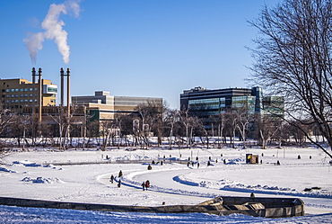 People walking and skating along the Red River Mutual Trail in Winnipeg, where artistic warming huts are on display, Winnipeg, Manitoba, Canada