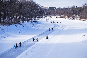 People walking and skating along the Red River Mutual Trail, Winnipeg, Manitoba, Canada