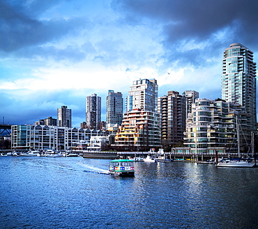 Sunset over Yaletown with boats in the harbour, Vancouver, British Columbia, Canada