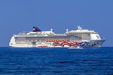 An Atlantis submarine cruises by the MS Pride of America, a Norwegian Cruise Line vessel, and lifeboats anchored off Kailua-Kona, the Big Island, Hawaii, USA during the summer, Island of Hawaii, Hawaii, United States of America