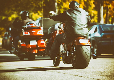 Very customized motorcycles traveling along a street during an event, Edmonton, Alberta, Canada