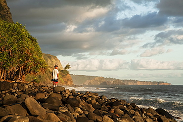 A fisherman stands fishing along the Hamakua coast, Lapahoehoe Nui Valley, Island of Hawaii, Hawaii, United States of America