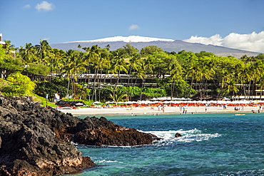 Kaunaoa Beach, Mauna Kea Beach and Hotel, and a view of Mauna Kea with snow on the Big Island, Island of Hawaii, Hawaii, United States of America