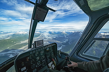 Flying in a helicopter over the icefields in Kluane National Park, near Haines Junction, Yukon, Canada