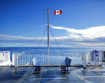 Deck of the new BC Ferry with a Canadian Flag, going to Mayne Island, British Columbia, Canada