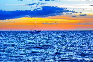 Sailboat in the ocean off the coast of Kamaole One and Two beaches, Kamaole Beach Park, Kihei, Maui, Hawaii, United States of America