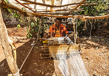 Konso man weaving cloth on his loom, Karat-Konso, Southern Nations Nationalities and Peoples' Region, Ethiopia