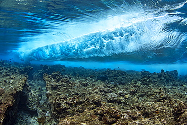 Surf crashes on the reef off the island of Yap in Micronesia. Underwater view of a wave breaking, Yap, Federated States of Micronesia