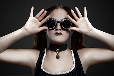 Glamour shot of girl in steampunk outfit on a black background, Toronto, Ontario, Canada