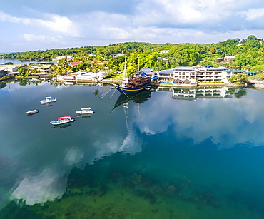 View from the water of the Manta Ray Bay Resort and it's floating restaurant 'The Mnuw', Yap, Micronesia