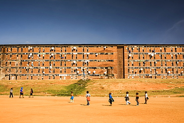 Children playing outside a workers' hostel in Alexandra Township, Johannesburg, Gauteng, South Africa