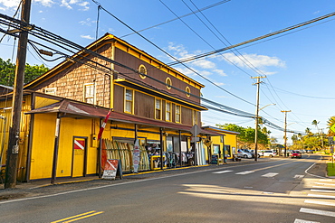 Surf town of Haleiwa, with a bright yellow building renting surfboards, Haleiwa, Oahu, Hawaii, United States of America