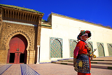 Water Carrier in from of Mausoleum of Moulay Ismail, Meknes, Morocco, North Africa, Africa