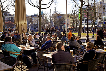 People drinking at cafe in Rembrandtplein, Amsterdam, Netherlands, Europe