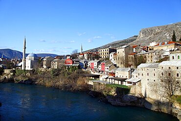 Koski Mehmed Pasa Mosque and coloured buildings from rebuilt Old Bridge, Mostar, Herzegovina, Bosnia And Herzegovina, Europe