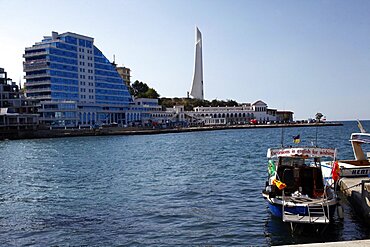 Tourist excursion boat and obelisk, Sevastopol, Crimea, Ukraine, Europe