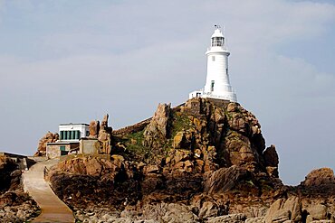 Rocks and white La Corbiere Lighthouse, Jersey, Channel Islands, United Kingdom, Europe