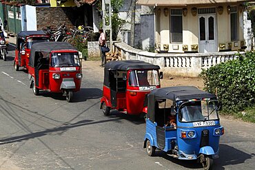 Red and blue tuk-tuks, Matale, Sri Lanka, Asia